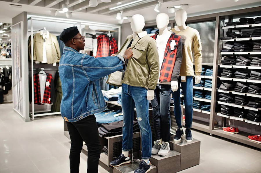 Guy checking the cloths on Mannequin