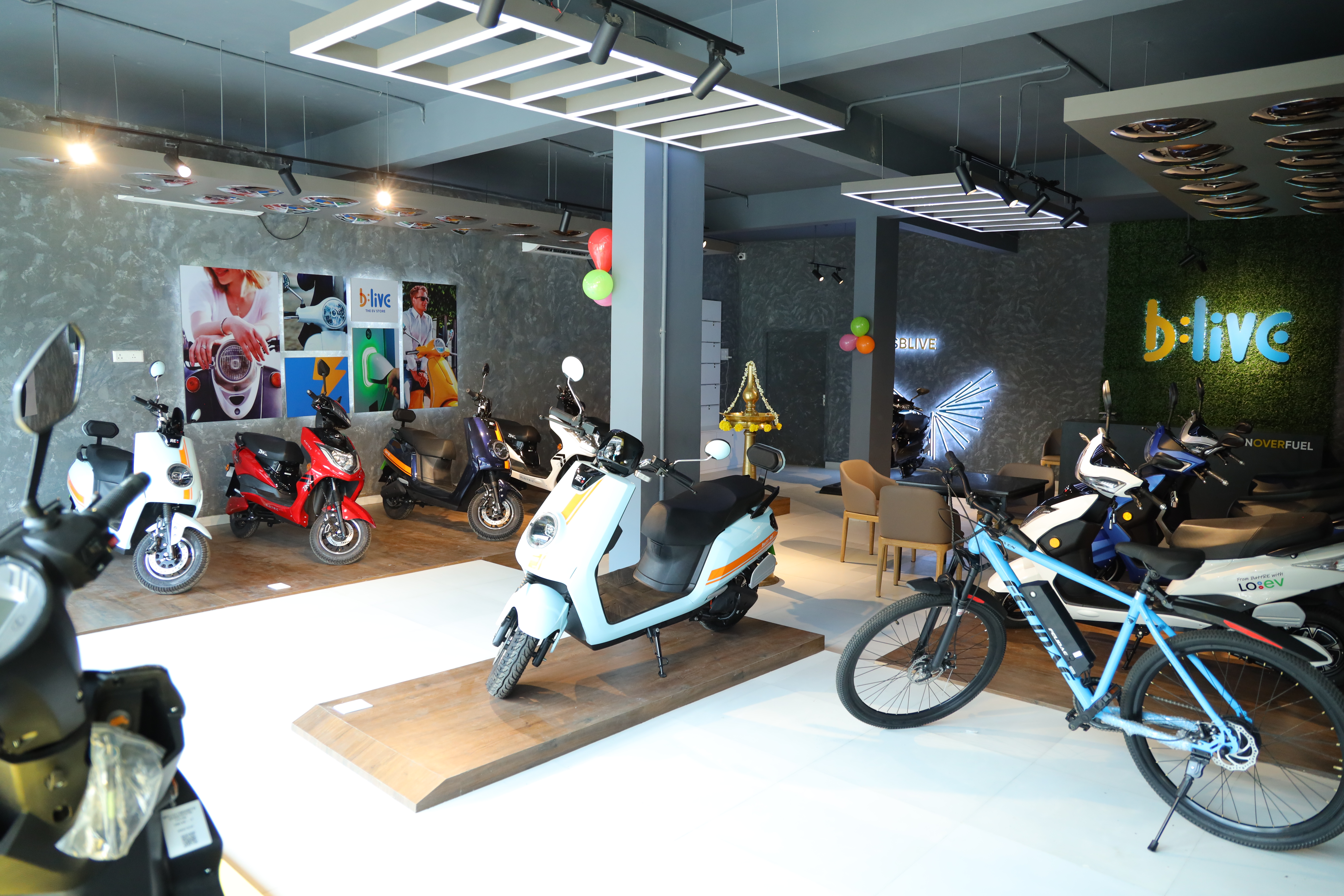 BLive store inside look with EV scooters and Bicycle on display