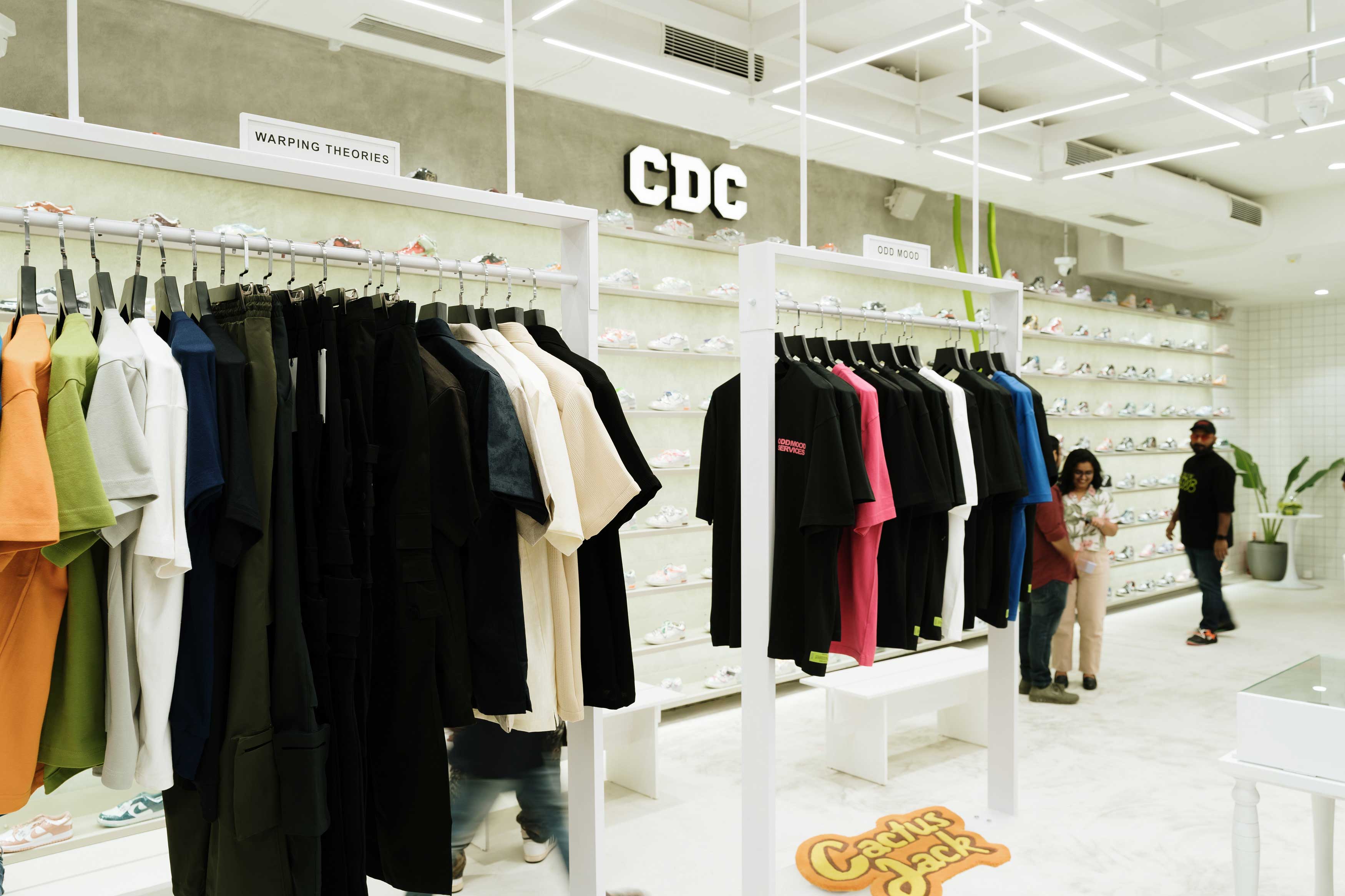 Inside look into retail store with cloths hung