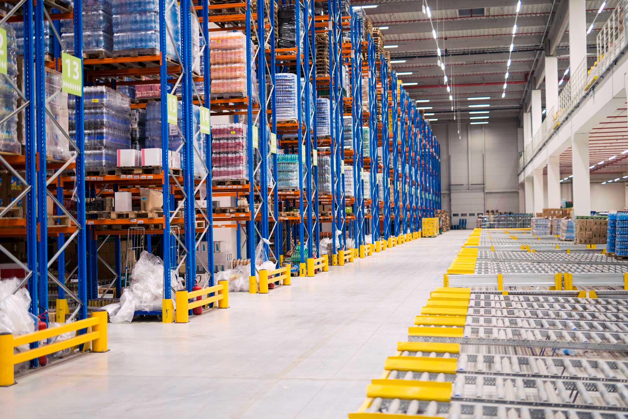 Warehouse storage interior with shelves loaded with goods