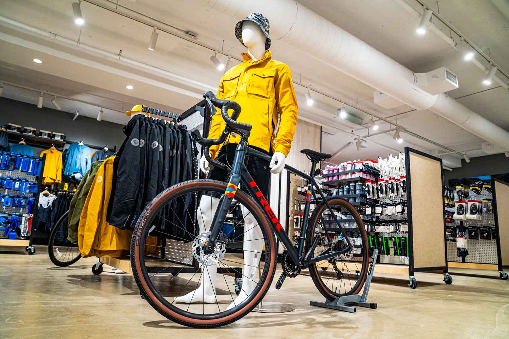 Mannequin along with bicycle on display inside store 