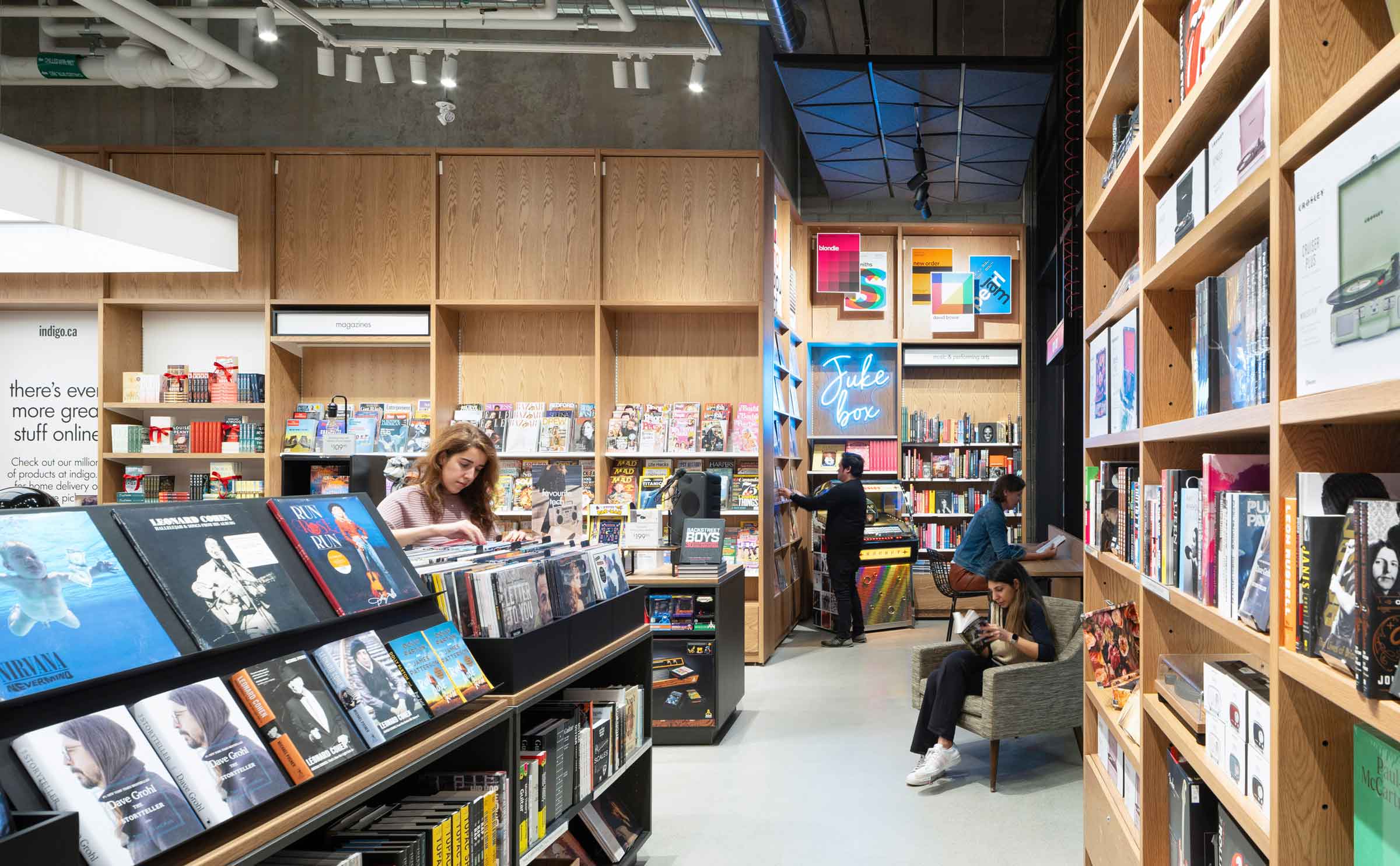 People reading, checking the books inside store